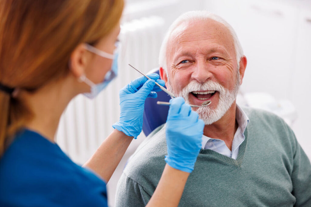 Doctor checking up patient at dentist office