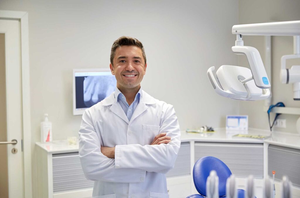 dentist-standing-in-background-talking-about-dentures