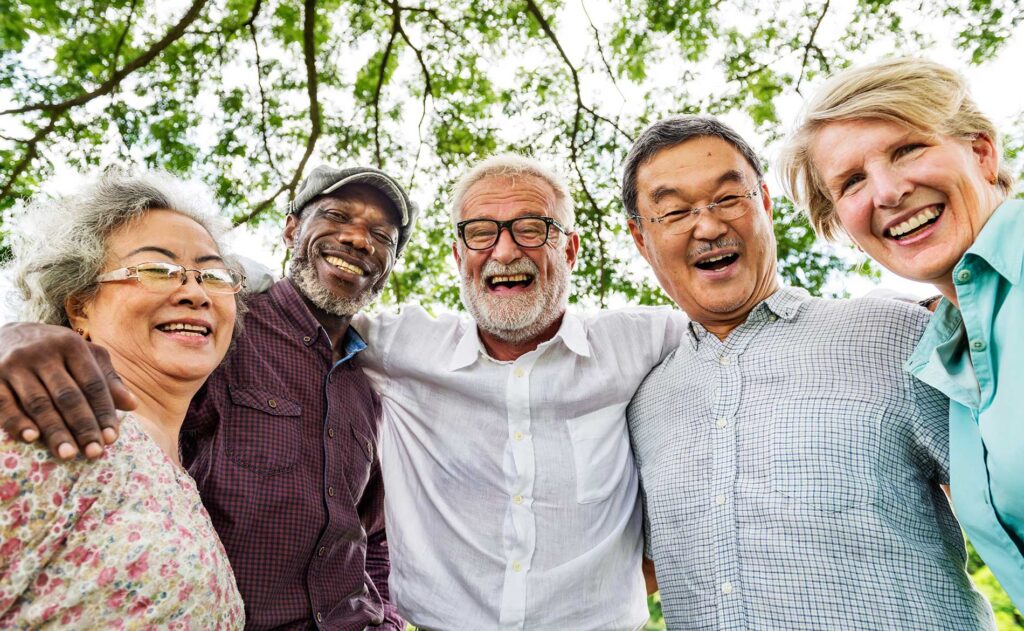 elderly people together smiling