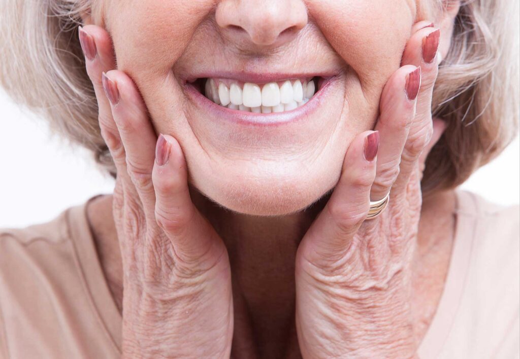 senior-showing-off-her-new-teeth senior-showing-off-her-new-teeth