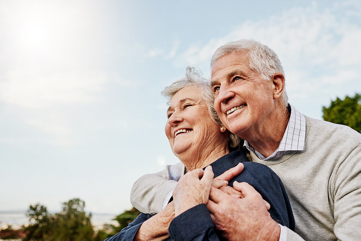 elderly couple and hug outdoors elderly couple and hug outdoors